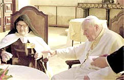 Sister Lucia with Pope John Paul II in Fatima, Portugal, in 2000.  The Pope believed the Virgin Mary of Fatima helped save his life.